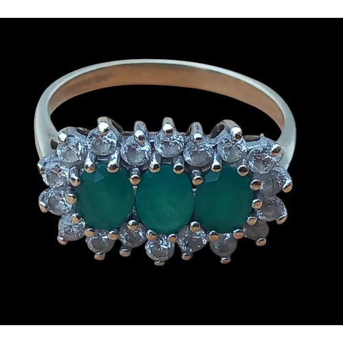 718 - A 9ct 3 EMERALD SET RING