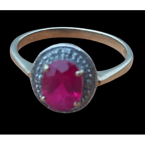 729 - A 9ct GOLD RUBY SET RING