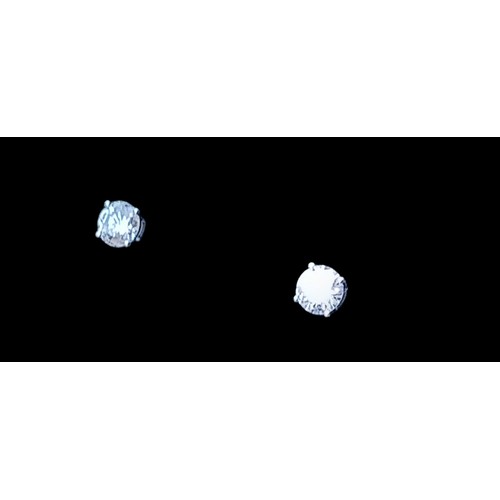 683 - A NEW PAIR OF 9ct WHITE GOLD DIAMOND (0.25ct) STUD EARRINGS