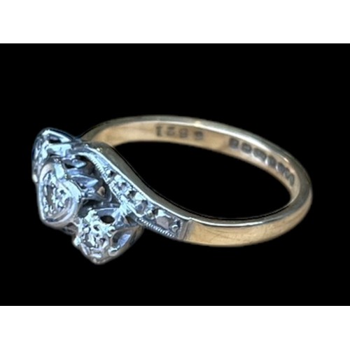 684 - AN 18CT GOLD DIAMOND RING WITH A HEART DESIGN