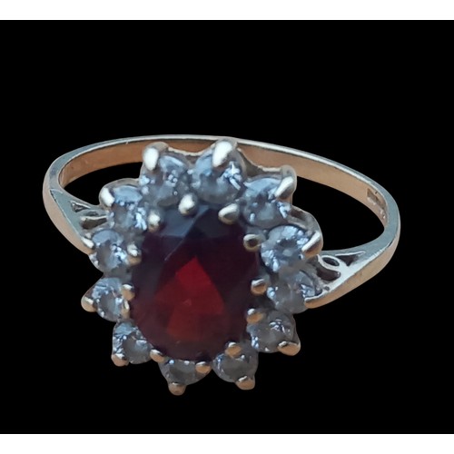 341 - A 9ct GOLD GARNET SET RING