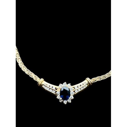 631 - A 14CT GOLD NECKLACE SET WITH A CENTRAL SAPPHIRE & DIAMONDS