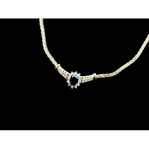 631 - A 14CT GOLD NECKLACE SET WITH A CENTRAL SAPPHIRE & DIAMONDS