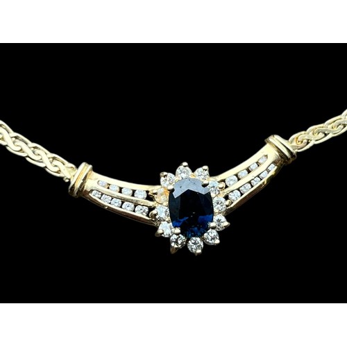 631 - A 14CT GOLD NECKLACE SET WITH A CENTRAL SAPPHIRE & DIAMONDS