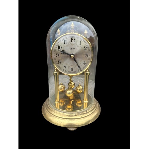 34 - A GLASS DOMED ANNIVERSARY CLOCK