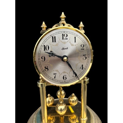 34 - A GLASS DOMED ANNIVERSARY CLOCK