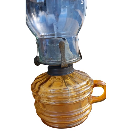 133 - AN AMBER GLASS FINGER LAMP & CLEAR GLASS HANDLE