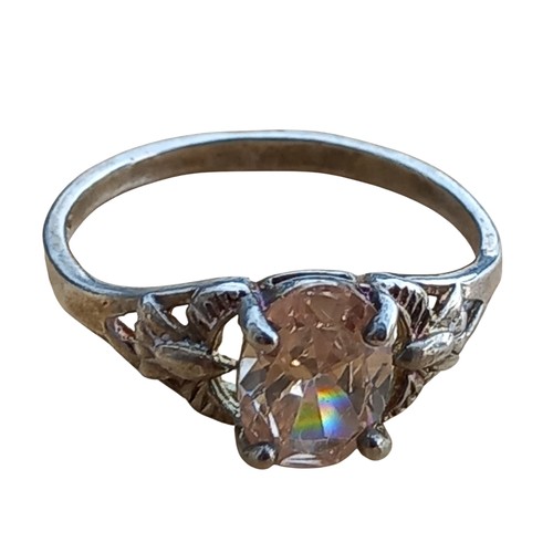 203 - AN ORNATE SILVER & CITREN STYLE RING