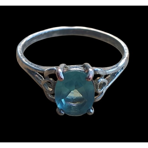 235 - AN ORNATE SILVER BLUE TOPAZ RING