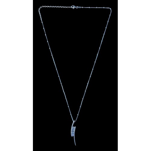 234 - A SILVER GEM SET PENDANT ON AN USUAL KNOTTED SILVER CHAIN