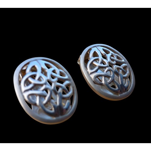 275 - A LARGE PAIR OF SILVER CLIP ON CELTIC DESIGN EARRINGS