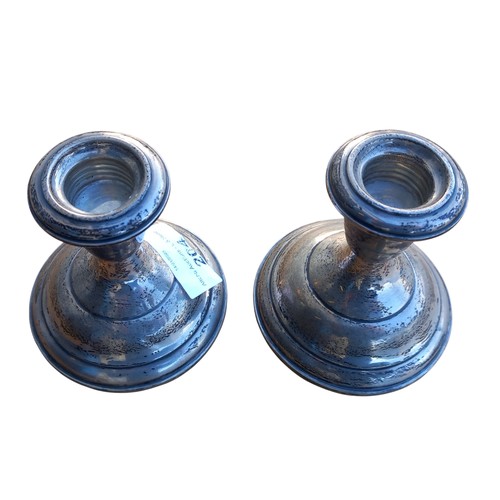 204 - A PAIR OF DWARF STERLING SILVER CANDLESTICK