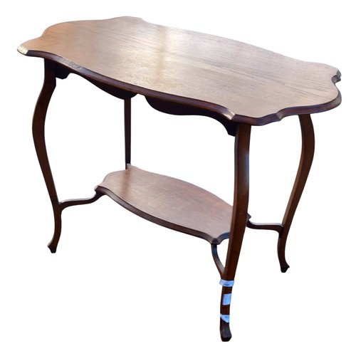 348 - AN ANTIQUE (OAK ) SHAPED WINDOW TABLE WITH BOTTOM SHELF