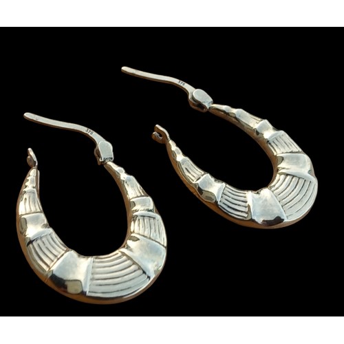 592 - A PAIR OF OVAL CREOLE PATTERNED EARRINGS 1.6G