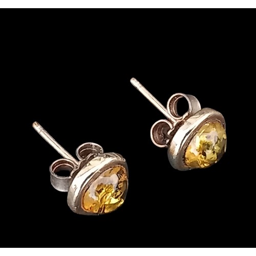 594 - A PAIR OF 9CT GOLD STUD EARRINGS WITH AMBER CENTRE