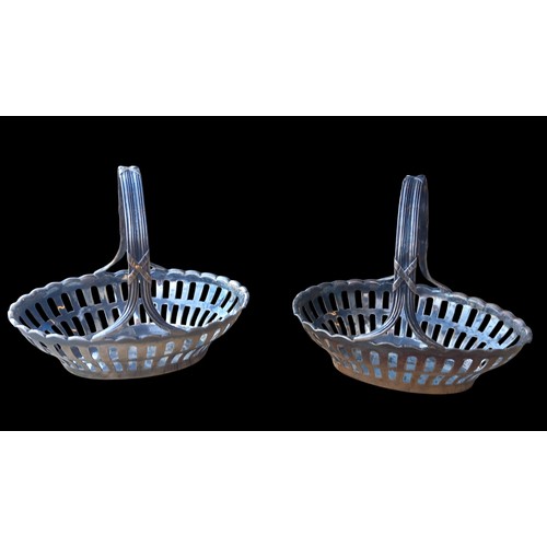 607 - A PAIR OF SMALL PIERCED SILVER BASKETS