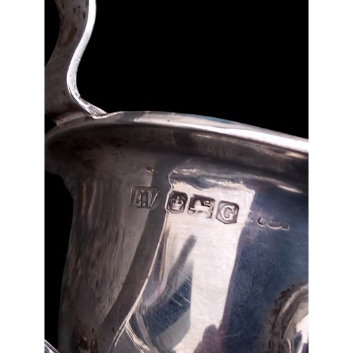 612 - A BEAUTIFUL SHEFFIELD SILVER SAUCE BOAT WITH A CELTIC DESIGN TO RIM AND HANDLE  ON TRIPOD FOOT 140gr... 