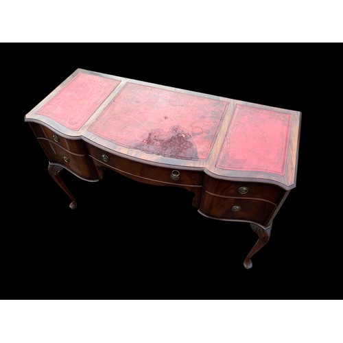 425 - A RED LEATHER KNEEHOLE DESK