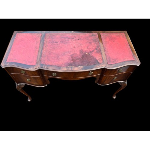 425 - A RED LEATHER KNEEHOLE DESK