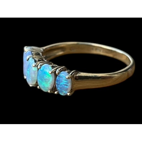 634 - A 9CT GOLD RING SET WITH 5 BEAUTIFUL OVAL FIRE OPALS ALL IN CLAW MOUNTS