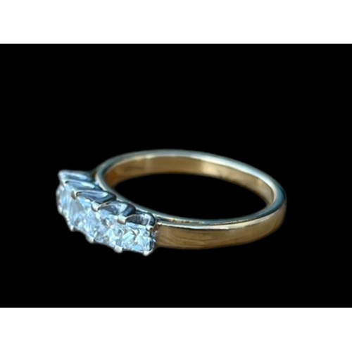 647 - A YELLOW GOLD RING SET WITH 5 PRINCESS CUT DIAMONDS APPROX 1.25CT TOTAL IN WHITE MOUNTD