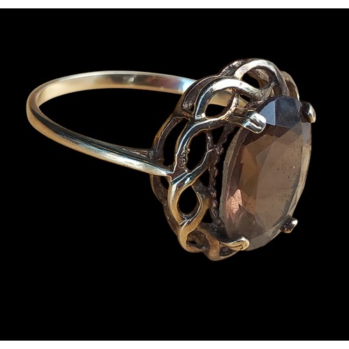 663 - AN 9CT SMOKEY QUARTZ RING