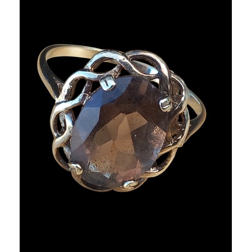 663 - AN 9CT SMOKEY QUARTZ RING