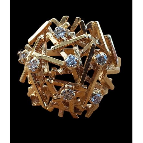 664 - A DOME SHAPED OPEN WORK DIAMOND SET RING WEIGHS 5.54G IN 9CT GOLD (ONE STONE MISSING)