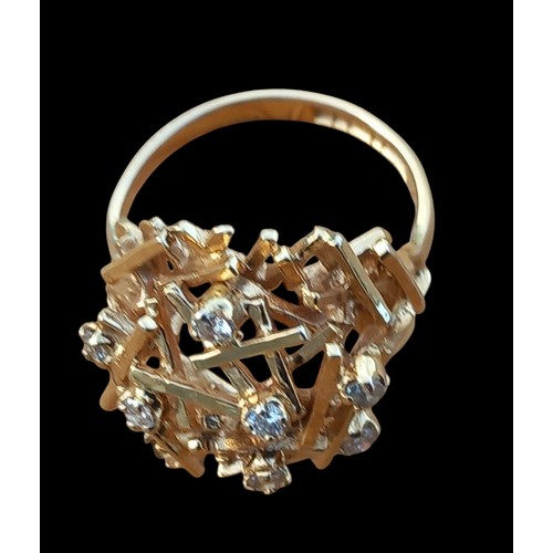 664 - A DOME SHAPED OPEN WORK DIAMOND SET RING WEIGHS 5.54G IN 9CT GOLD (ONE STONE MISSING)