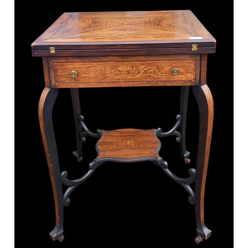 719 - A SUPERB ANTIQUE ROSEWOOD HEAVILY INLAID ENVELOPE TABLE