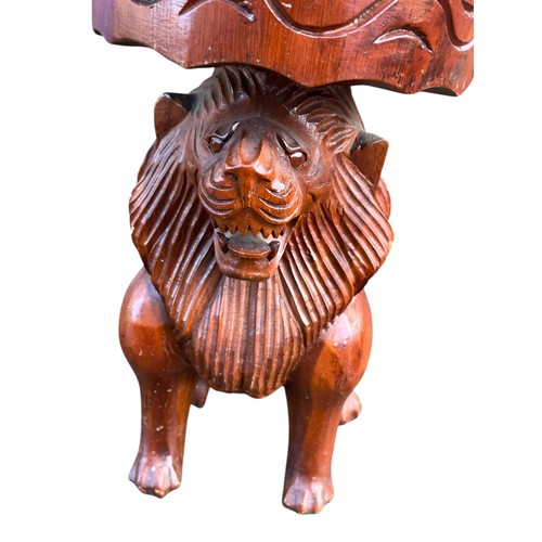 728 - A  MAHOGANY STOOL WITH CARVED LION BASE