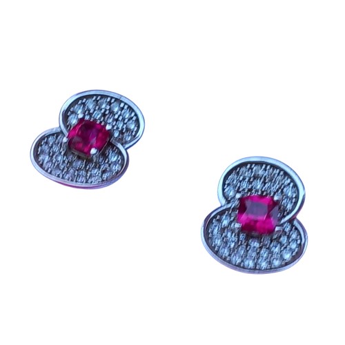 505 - A SILVER POPPY GEM SET EARRINGS SET WITH RED STONES