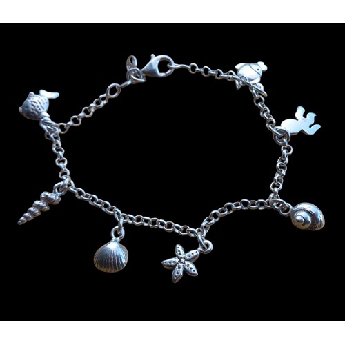 550 - A SILVER SEASIDE THEMED CHARM BRACELET COMPLETE CHARMS