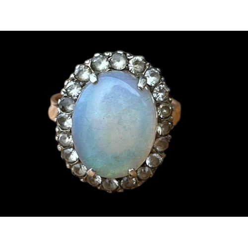 622A - A 9CT GOLD (TESTED) RING SET WITH LARGE OPAL STYLE STONE