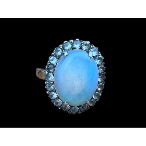 622A - A 9CT GOLD (TESTED) RING SET WITH LARGE OPAL STYLE STONE