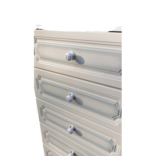 38 - A WHITE 4 DRAWERED DRESSING CHEST WITH PORCELAIN HANDLES