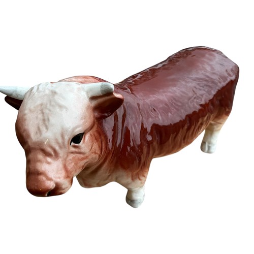 155 - A CERAMIC BUTCHERS BULL 19X31cm