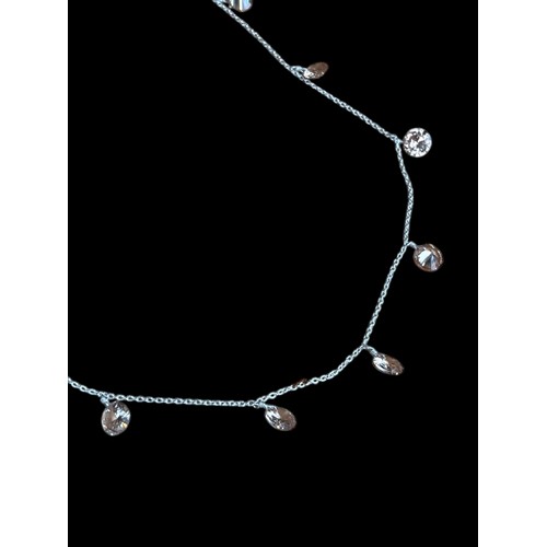 213 - A SILVER NECKLACE WITH SMOKEY STONES