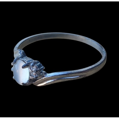 233 - A 10K WHITE GOLD GEM SET RING