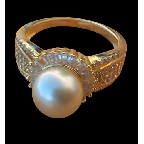 246 - A SILVER GILT GEM SET SILVER RING WITH A PEARL