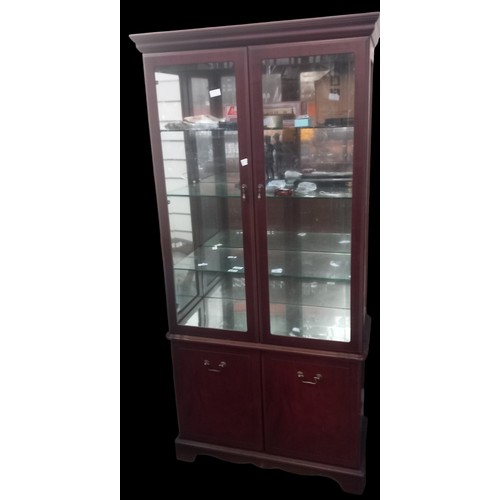 362 - A MAHOGANY DISPLAY CABINET OVER A BLIND CUPBOARD