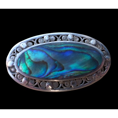 455 - AN ORNATE SILVER ABOLONE BROOCH