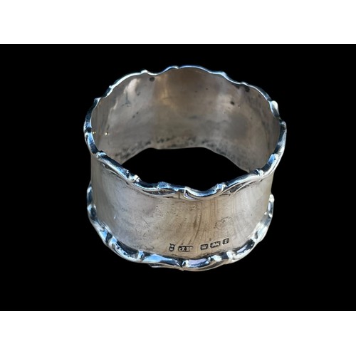 456 - AN ORNATE SILVER NAPKIN RING