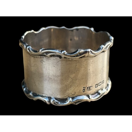 456 - AN ORNATE SILVER NAPKIN RING