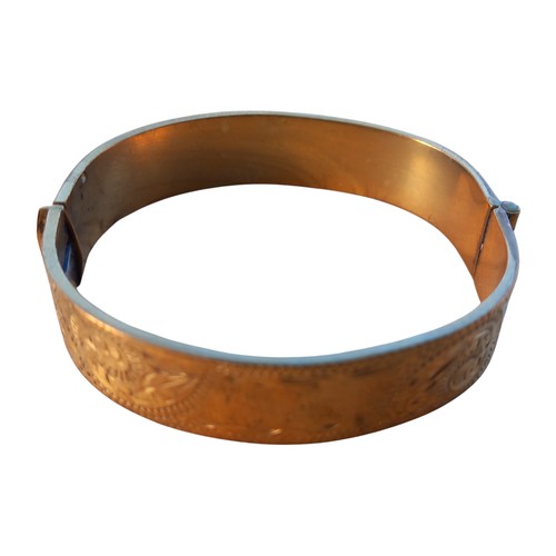 446 - 22ct GOLD HARDPLATED BRONZE CORE BANGLE