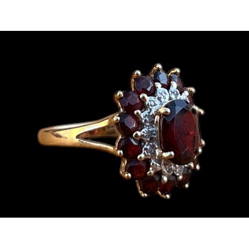 554 - A BEAUTIFUL 9ct GARNET AND DIAMOND CLUSTER RING