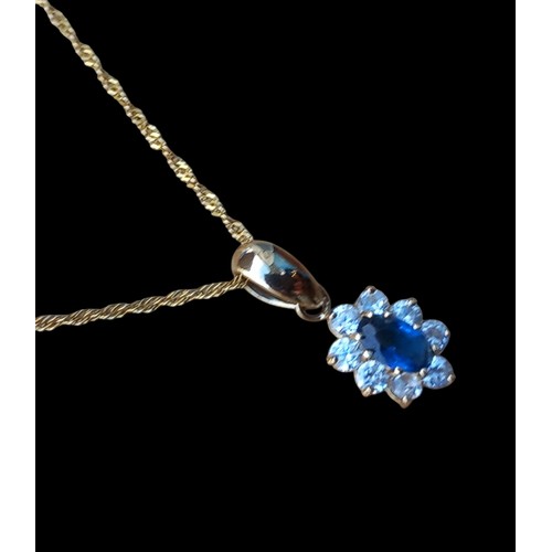 512 - 9ct SAPPHIRE SET PENDANT ON A 9ct GOLD CHAIN