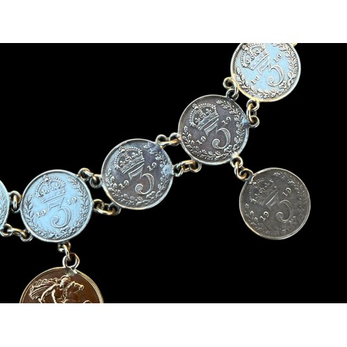 581 - A 1919 SILVER COIN BRACELET SET WITH A HALF 1908 SOVEREIGN COIN