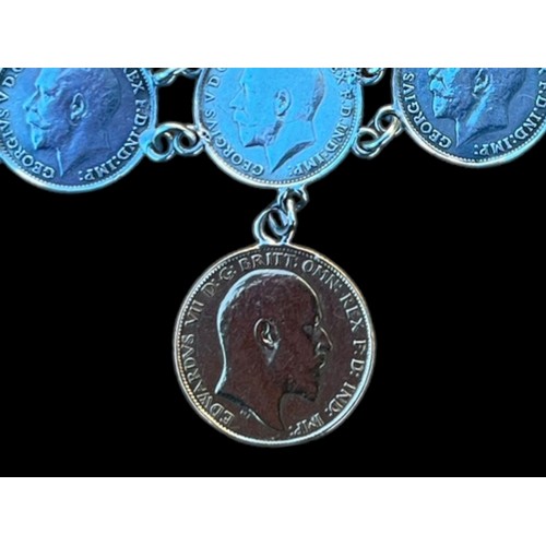 581 - A 1919 SILVER COIN BRACELET SET WITH A HALF 1908 SOVEREIGN COIN