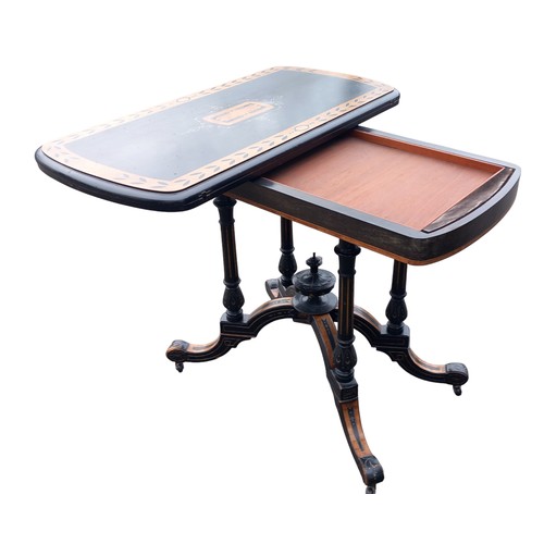 596 - A STUNNING QUALITY ANTIQUE EBONY & MAPLE TURN OVER LEAF CARD TABLE ON AN ORNATE QUAD BASE